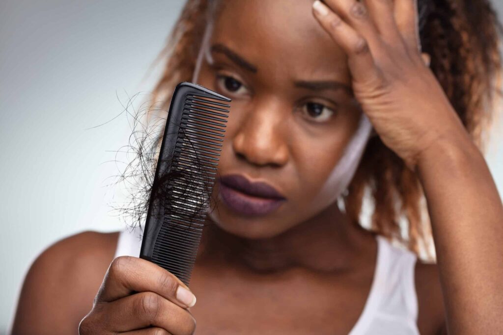 woman combing her hair