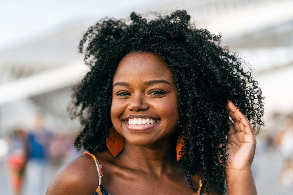 Smiling black woman in the city